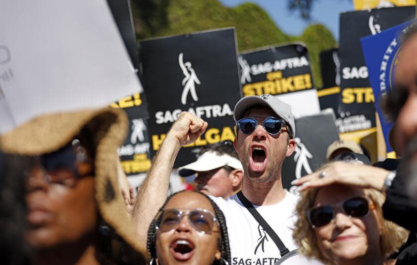 BURBANK-CA-AUGUST 22, 2023: SAG-AFTRA and WGA join forces with the AFL-CIO and its affiliates from across the nation and across industries for a national day of solidarity rally outside of Disney Studios in Burbank on August 22, 2023, fighting for fair contracts, better compensation, safe working conditions and protections from encroaching technology. (Christina House / Los Angeles Times)