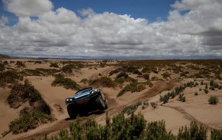 Dakar Rally - 2017 Paraguay-Bolivia-Argentina Dakar rally - 39th Dakar Edition - Fifth stage from Tupiza to Oruro, Bolivia 06/01/17. Romain Dumas of France drives his Peugeot with his copilot Alain Guehennec. REUTERS/Ricardo Moraes