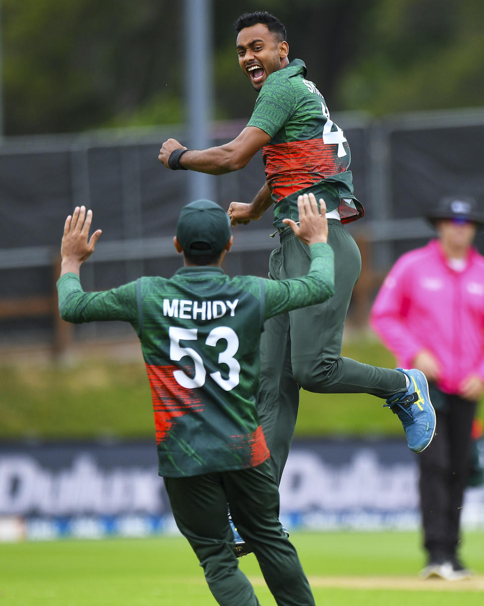 Bangladesh player Shoriful Islam celebrates the wicket of New Zealand's Henry Nicholls during the first One Day cricket international between New Zealand and Bangladesh at University Oval in Dunedin, New Zealand, Sunday, Dec. 17, 2023. (Chris Symes/Photosport via AP)