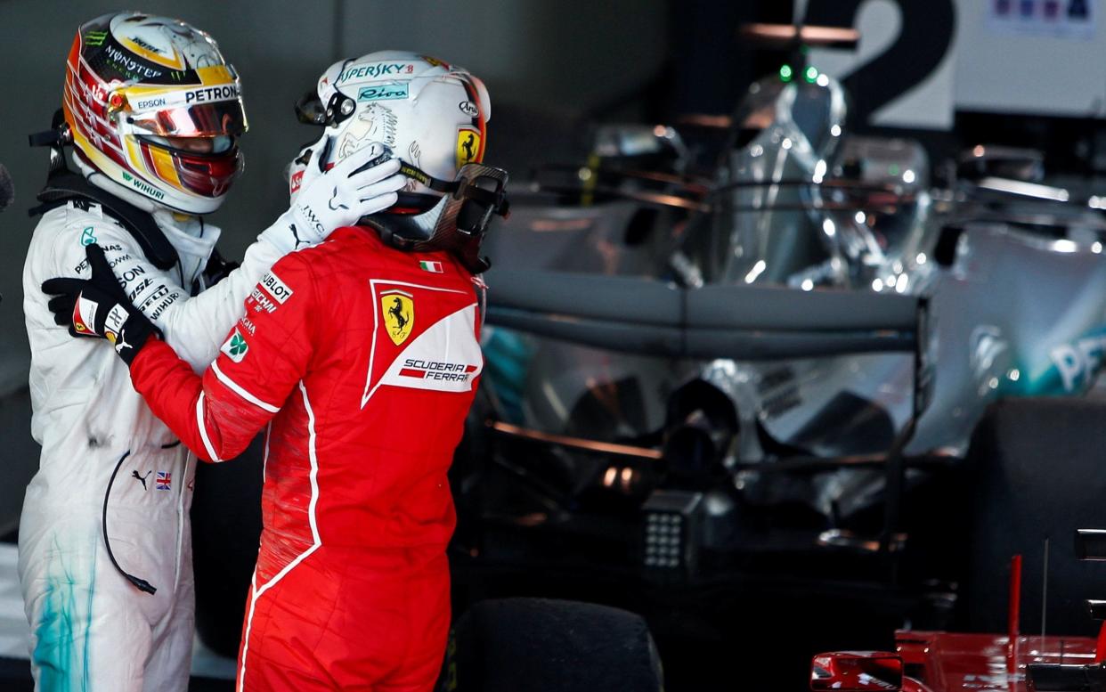 Lewis Hamilton and Sebastian Vettel congratulate each other - REUTERS