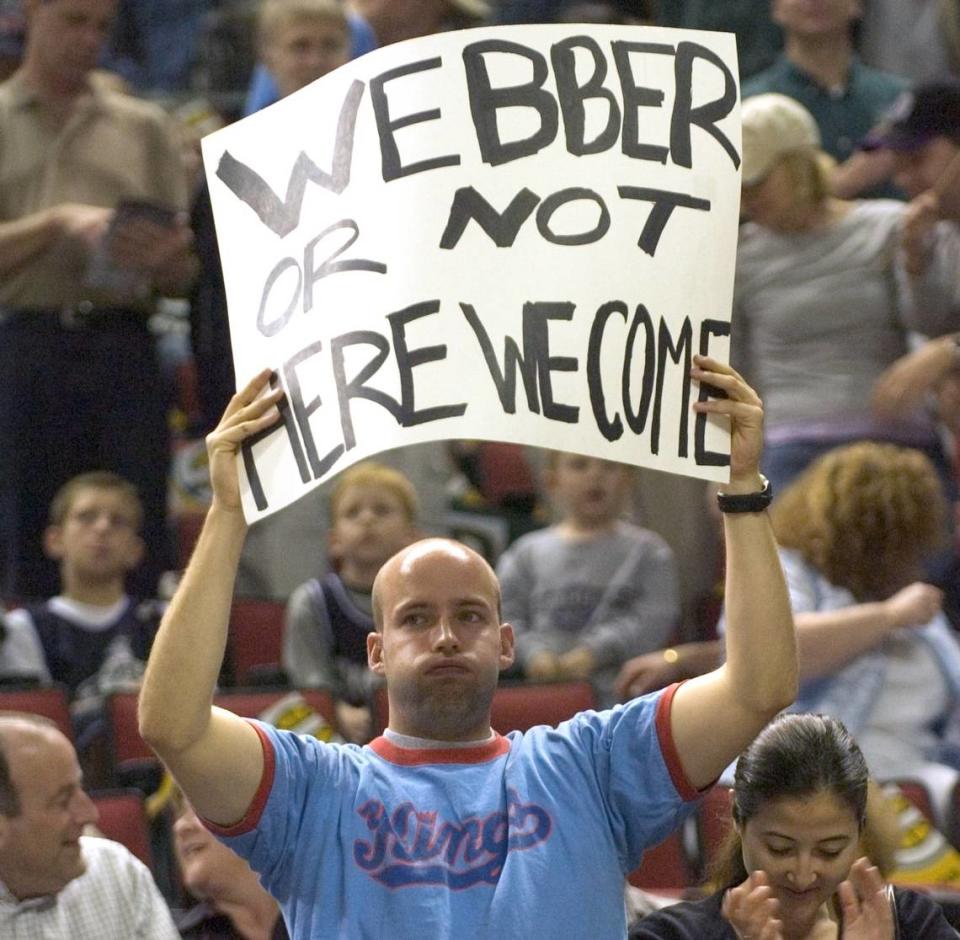 Sacramento Kings fan Jason Garland holds a sign referencing the absence of Chris Weber as his team plays the Seattle SuperSonics during Game 1 of the Western Conference playoffs on Saturday, April 23, 2005, at Key Arena in Seattle, Wash.
