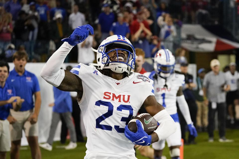 SMU safety Isaiah Nwokobia (23) celebrates his interception during the second half of the American Athletic Conference championship NCAA college football game against Tulane, Saturday, Dec. 2, 2023 in New Orleans. SMU won 26-14. (AP Photo/Gerald Herbert)