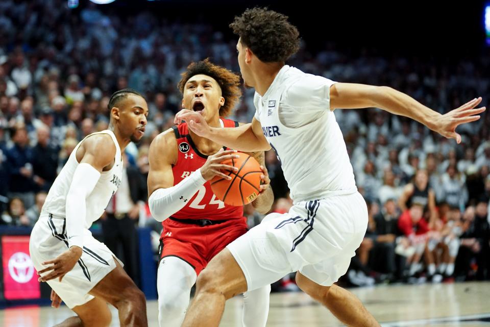 Cincinnati Bearcats guard Jeremiah Davenport (24) drives to the basket as Xavier Musketeers guard Colby Jones (3) defends in the first half of the 89th Annual Crosstown Shootout college basketball game, Saturday, Dec. 11, 2021, at Cintas Center in Cincinnati. 