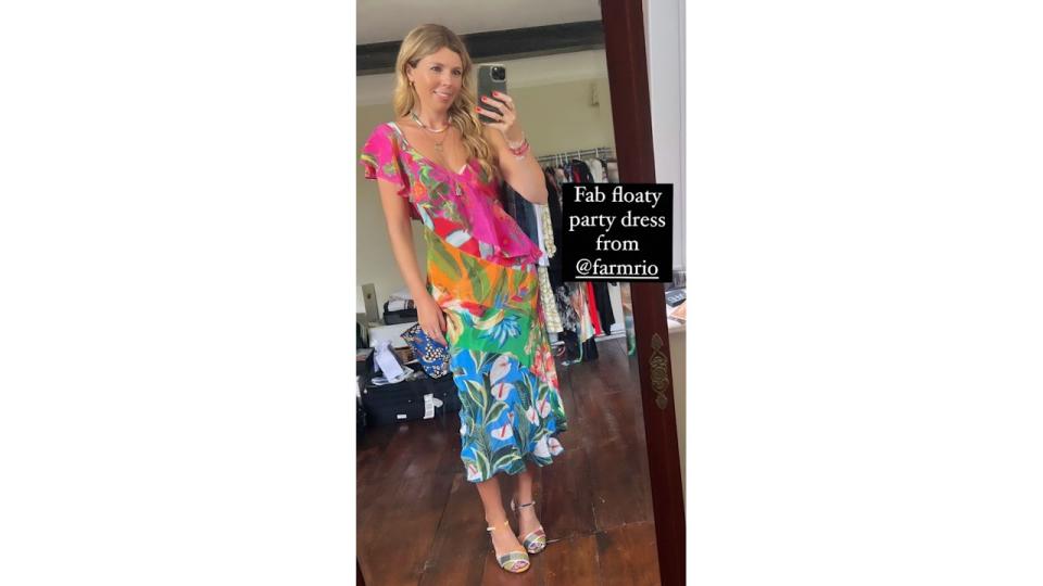 A photo of Carrie Johnson wearing a multicoloured dress