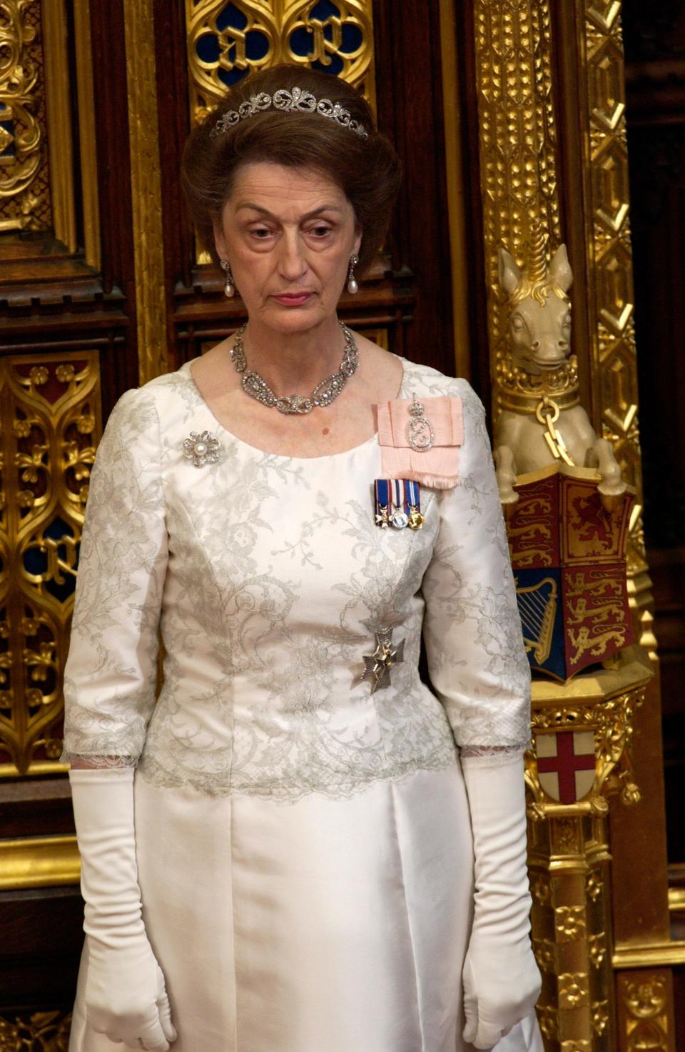 Lady Susan Hussey, a lady-in-waiting, accompanies the Queen at the State Opening of Parliament held in the House of Lords in November 2004.