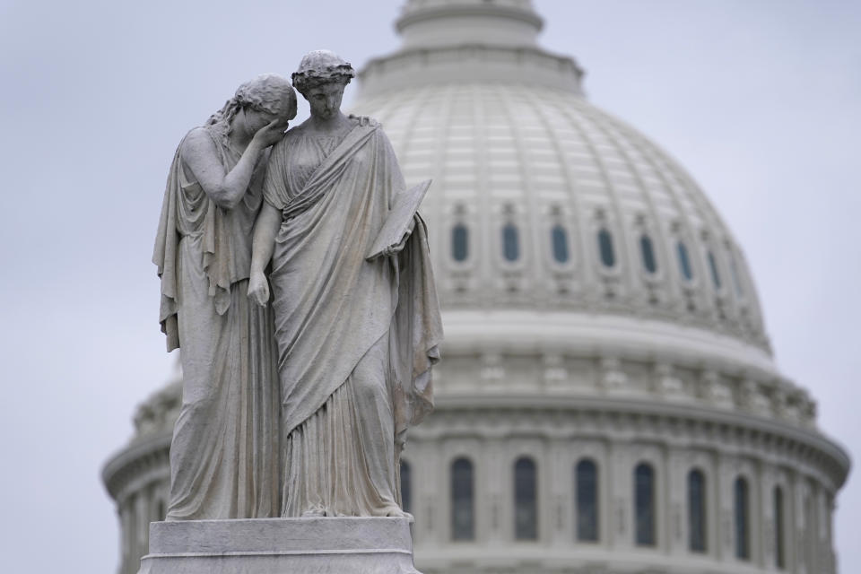 The Peace Monument, also known as the Naval Monument or Civil War Sailors Monument, is framed by the Capitol dome on Capitol Hill in Washington, Monday, Jan. 4, 2021. Protests are planned on January 6, the day when Congress is scheduled to meet to formally finalize the presidential election results. (AP Photo/Susan Walsh)