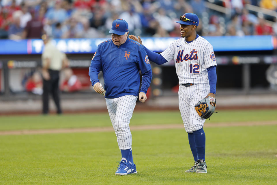New York Mets manager Buck Showalter and Francisco Lindor interact after a visit to the mound during the ninth inning of a baseball game, against the Philadelphia Phillies, Sunday, Oct. 1, 2023, in New York. (AP Photo/Noah K. Murray)