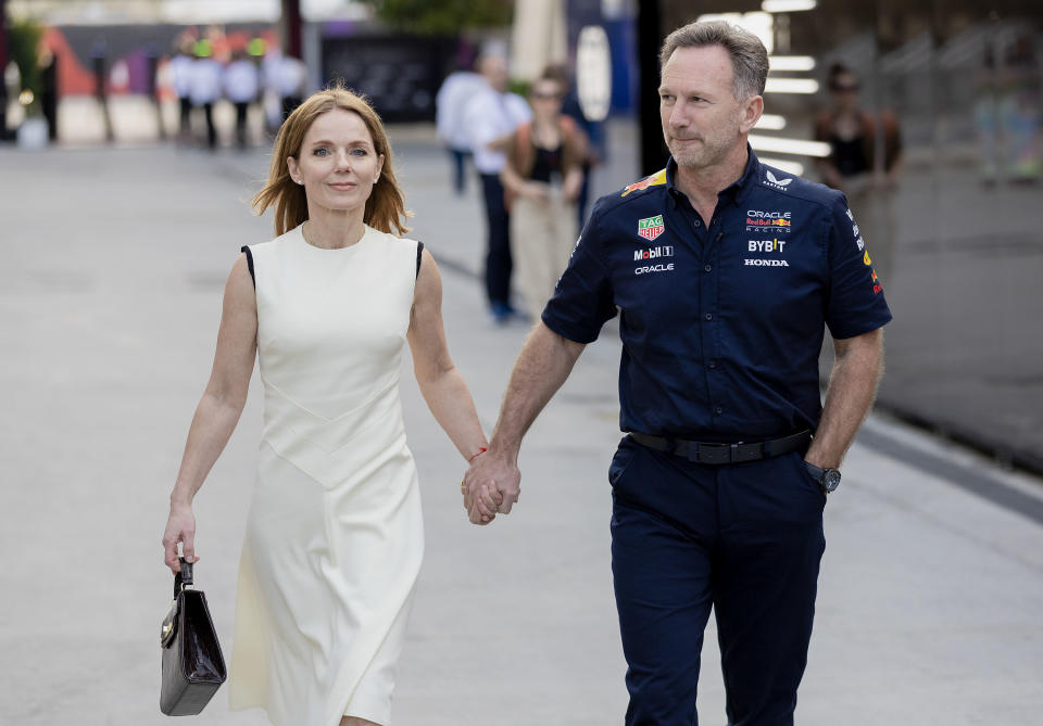BAHRAIN, BAHRAIN - MARCH 2: Christian Horner of Great Britain and Oracle Red Bull Racing holds hands with Geri Halliwell during the F1 Grand Prix of Bahrain at Bahrain International Circuit on March 2, 2024 in Bahrain, Bahrain. (Photo by Qian Jun/MB Media/Getty Images)