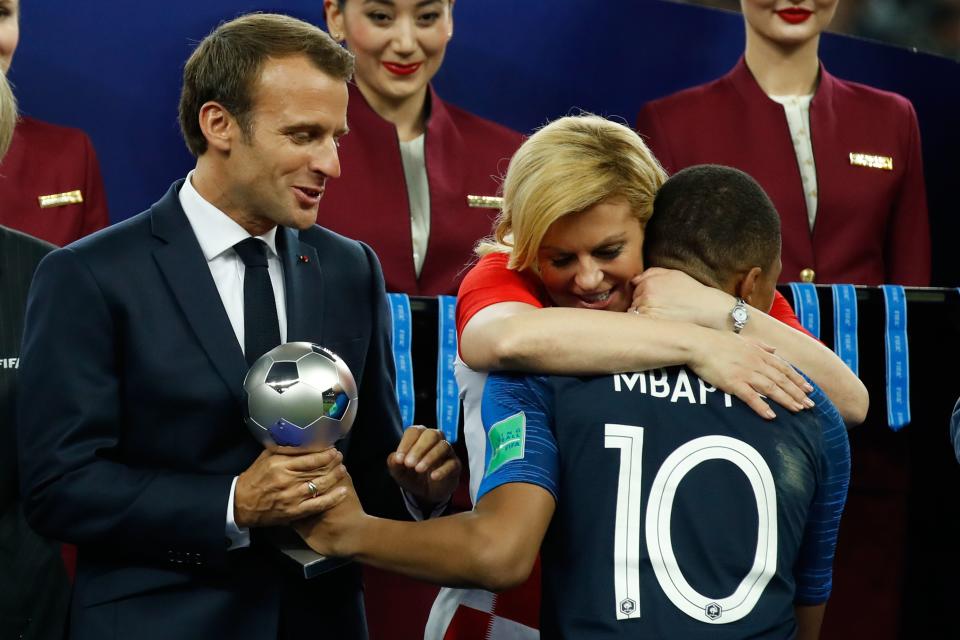 France’s Kylian Mbappe receives the silver ball for best young player from French President Emmanuel Macron and Croatian President Kolinda Grabar-Kitarovic during the medals ceremony after the Russia 2018 World Cup final. (Getty Images)