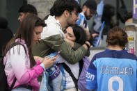 Napoli fans on the street in Naples react at the end of the Serie A soccer match between Napoli and Salernitana at the Diego Armando Maradona stadium, in Naples, Italy, Sunday, April 30, 2023. The game ended in a 1-1 draw and Napoli missed a chance to win the Italian title Sunday with six rounds left to play. (AP Photo/Gregorio Borgia)