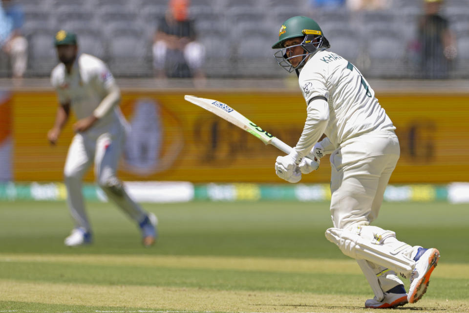 FILE - Usman Khawaja of Australia bats on the first day of the first cricket test between Australia and Pakistan in Perth, Australia, Dec. 14, 2023. Khawaja has been reprimanded by the International Cricket Council for wearing a black armband in support of Palestinians in Gaza during the first cricket test against Pakistan. (Richard Wainwright/AAP Image via AP, File)