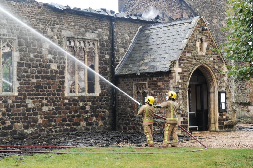 Eastern Daily Press: Firefighters at the scene of the fire at Wimbotsham Church, in 2019