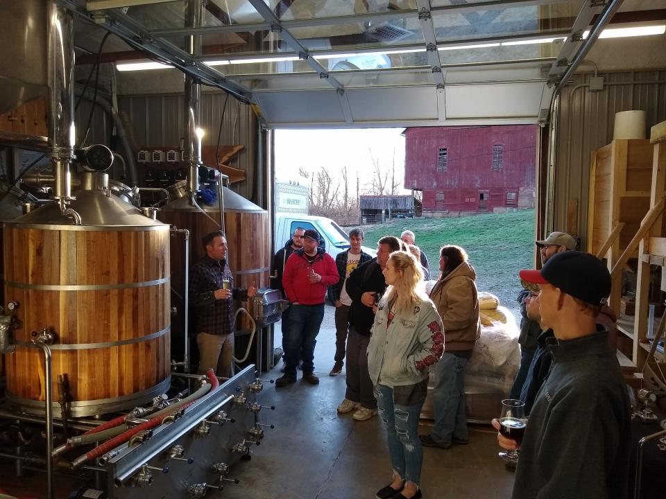Owner and brewmaster Kevin Ely gives a tour of the brewhaus to visitors at the Wooly Pig Farm Brewery.