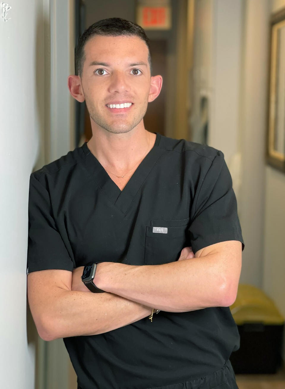 In this photo provided by Geller Family Dental, Dr. Andrew A. Geller, general and cosmetic dentist at Geller Family Dental poses at the practice on Thursday, Feb. 4, 2021, in Bronxville, N.Y. As more coronavirus vaccine doses become available, many business owners face a difficult decision: whether to require employees to be inoculated. Geller initially didn’t feel comfortable with requiring his staff to get the shots because of the many unknowns about the vaccine. But he did extensive research and concluded that the 23 employees at Geller Family Dental should be vaccinated. (Constantine Venetopoulos/Geller Family Dental via AP)