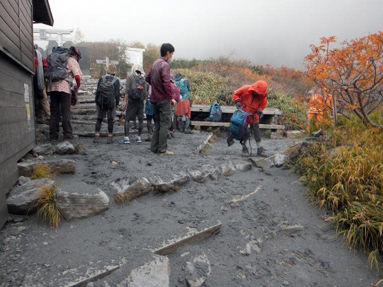 This picture taken by a climber Keiji Aoki on September 27, 2014 shows climbers evacuating from Mount Ontake as the volcano erupted