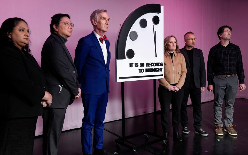 Bulletin of the Atomic Scientists members Asha George, Herb Lin, science educator Bill Nye, Rachel Bronson, Alexander Glaser and Daniel Holz with the latest Doomsday Clock