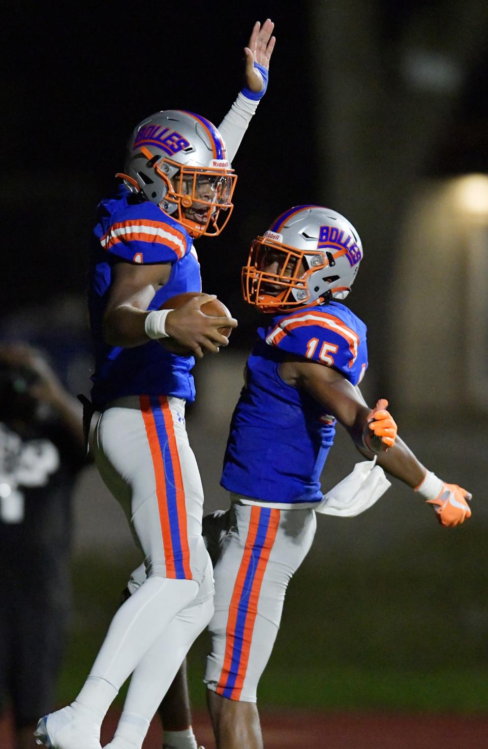 Bolles quarterback DJ Moore (1) and receiver Chase Collier (15) celebrate after a November touchdown against Episcopal.