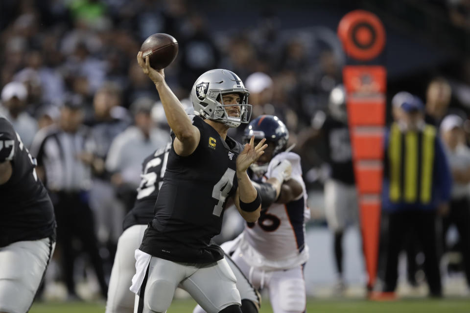 Oakland Raiders quarterback Derek Carr throws during the first half of an NFL football game against the Denver Broncos Monday, Sept. 9, 2019, in Oakland, Calif. (AP Photo/Ben Margot)