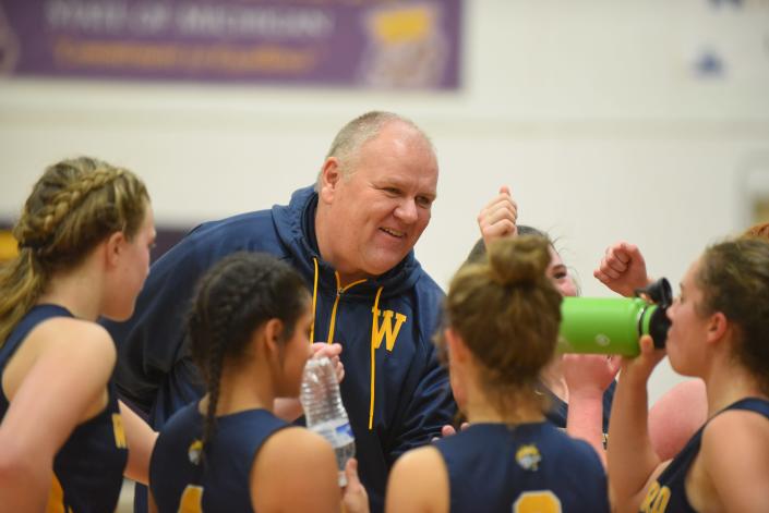 Whiteford girls basketball coach Les Manley talks to his players during a timeout.