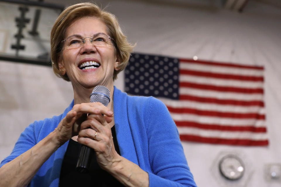 Democratic presidential candidate Sen. Elizabeth Warren (D-MA) in front of an American flag at a campaign rally at West High School on February 01, 2020 in Iowa City.