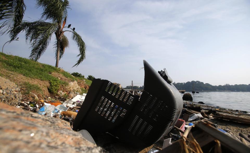 A television part is seen on Fundao beach in the Guanabara Bay in Rio de Janeiro March 13, 2014. According to the local media, the city of Rio de Janeiro continues to face criticism locally and abroad that the bodies of water it plans to use for competition in the 2016 Olympic Games are too polluted to host events. Untreated sewage and trash frequently find their way into the Atlantic waters of Copacabana Beach and Guanabara Bay - both future sites to events such as marathon swimming, sailing and triathlon events. REUTERS/Sergio Moraes (BRAZIL - Tags: ENVIRONMENT SPORT OLYMPICS)