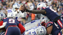 New England Patriots middle linebacker Ja'Whaun Bentley, right, knocks the ball out of the hands of Dallas Cowboys quarterback Dak Prescott, left, on a touchdown attempt at the goal line during the first half of an NFL football game, Sunday, Oct. 17, 2021, in Foxborough, Mass. (AP Photo/Steven Senne)