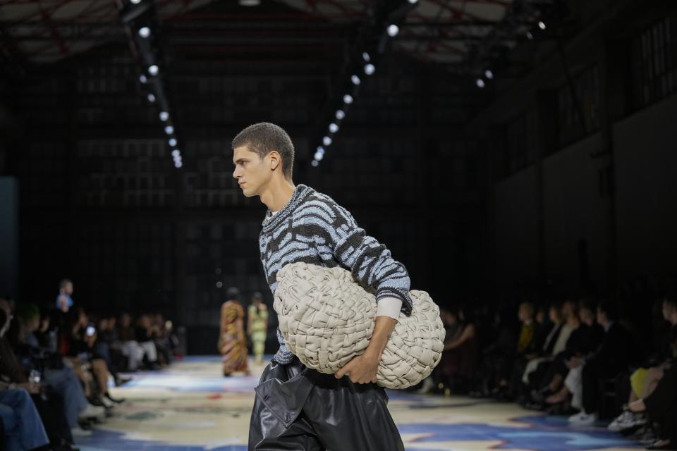 A model wears a creation as part of the Bottega Veneta women's Spring Summer 2024 collection presented in Milan, Italy, Saturday, Sept. 23, 2023. (AP Photo/Antonio Calanni)