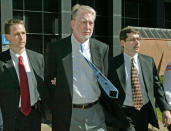 <b>Bernie Ebbers</b><br><br>Bernie Ebbers is currently serving a 25-year sentence at the <a href="http://money.cnn.com/2006/09/26/news/newsmakers/ebbers_prison/index.htm" rel="nofollow noopener" target="_blank" data-ylk="slk:Oakdale Federal Correctional Institution;elm:context_link;itc:0;sec:content-canvas" class="link ">Oakdale Federal Correctional Institution</a> in Louisiana. The former WorldCom CEO was convicted in 2005 of conspiracy, securities fraud and filing false documents with regulators after his involvement in an $11 billion fraud within the company. <br><br>Photo: Former WorldCom executive Bernie Ebbers, center, leaves the federal building for an arraignment in custody March 3, 2004 in New York City.