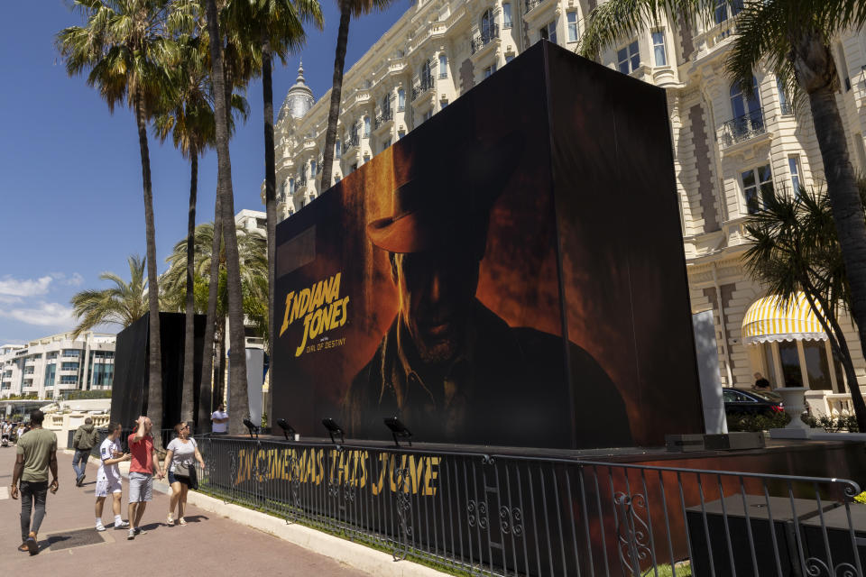 The official poster for 'Indiana Jones and the Dial of Destiny' is pictured outside the entrance of the Carlton hotel ahead of the Cannes film festival, in Cannes, southern France, Monday, May 15, 2023. The 76th edition of the film festival runs from May 16 until May 27. (Photo by Joel C Ryan/Invision/AP)