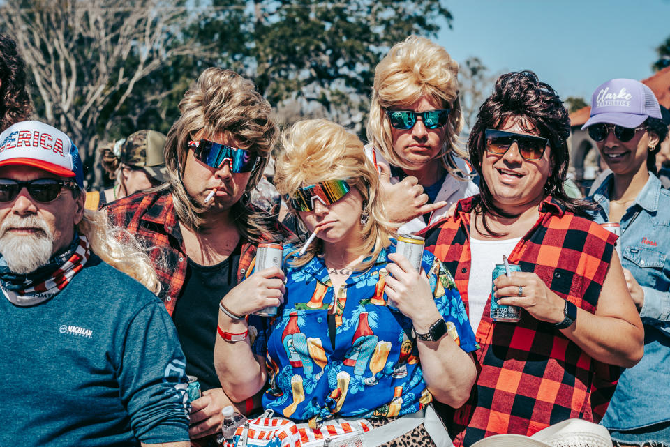 The mullet-clad spectators came to the event in their Florida Man best attire.  (Florida Man Game)