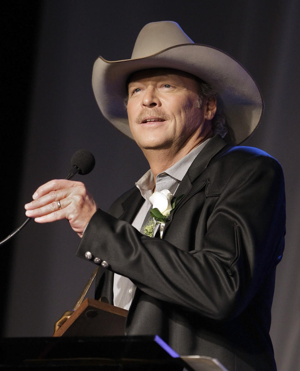 FILE - Alan Jackson speaks as he is inducted into the Nashville Songwriters Hall of Fame, in Nashville, Tenn. The release of his latest album "Thirty Miles West" caps an emotional period for the 53-year-old and his family. His wife has now been cancer free for a year. And Jackson split with Arista Nashville, ending a two-decade partnership that produced more than 43 million albums sold. He signed with Capitol/EMI Records Nashville and "Thirty Miles West" is out on his own imprint, ACR. (AP Photo/Mark Humphrey, File)