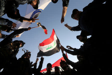 Iraqi Federal police celebrate in West Mosul, Iraq. REUTERS/Alaa Al-Marjani