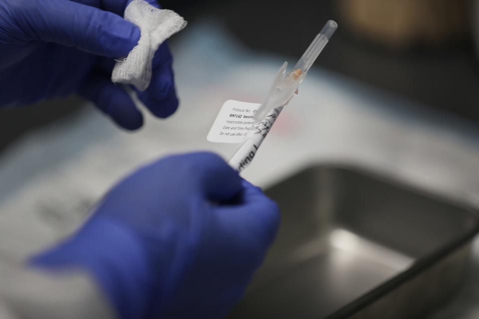 COVID-19 vaccination being prepared on Aug. 7, 2020, in a trial in  Hollywood, Florida.