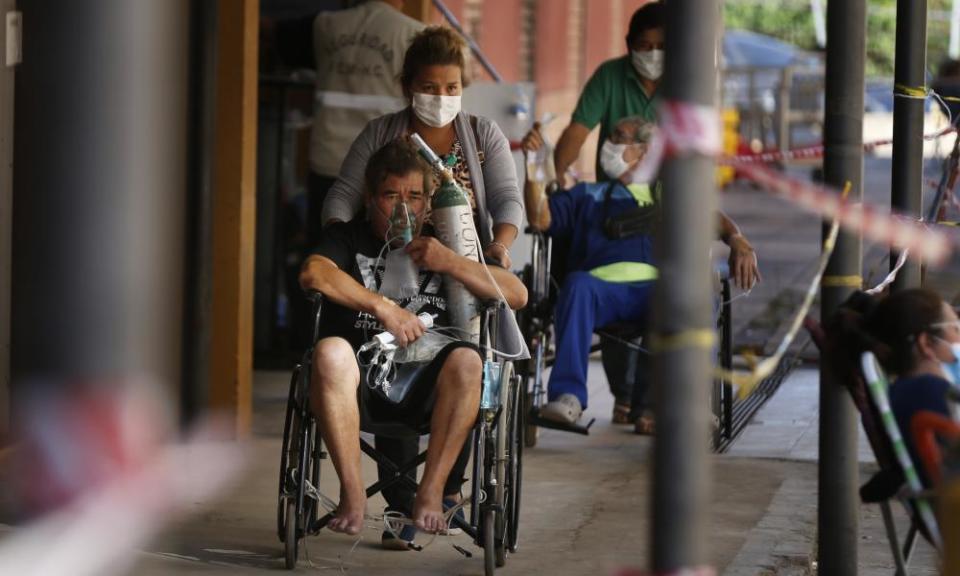 Coronavirus patients are taken to the lab for a test at the Clinicas hospital in San Lorenzo, Paraguay.