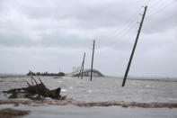 Storm surge from Hurricane Dorian blocks Cedar Island off from the mainland on NC 12 in Atlantic Beach, N.C., after Hurricane Dorian past the coast on Friday, Sept. 6, 2019. (AP Photo/Tom Copeland)