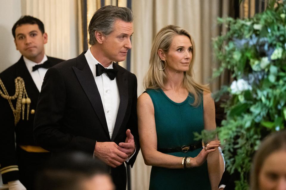 California Gov. Gavin Newsom and his wife, Jennifer Siebel Newsom, attend a black-tie dinner for U.S. governors and their spouses at the White House on Feb. 24, 2024.