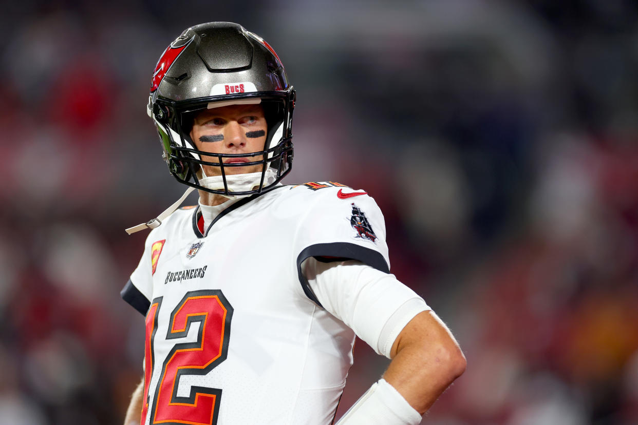 TAMPA, FLORIDA - JANUARY 16: Tom Brady #12 of the Tampa Bay Buccaneers warms up prior to a game against the Dallas Cowboys in the NFC Wild Card playoff game at Raymond James Stadium on January 16, 2023 in Tampa, Florida. (Photo by Mike Ehrmann/Getty Images)