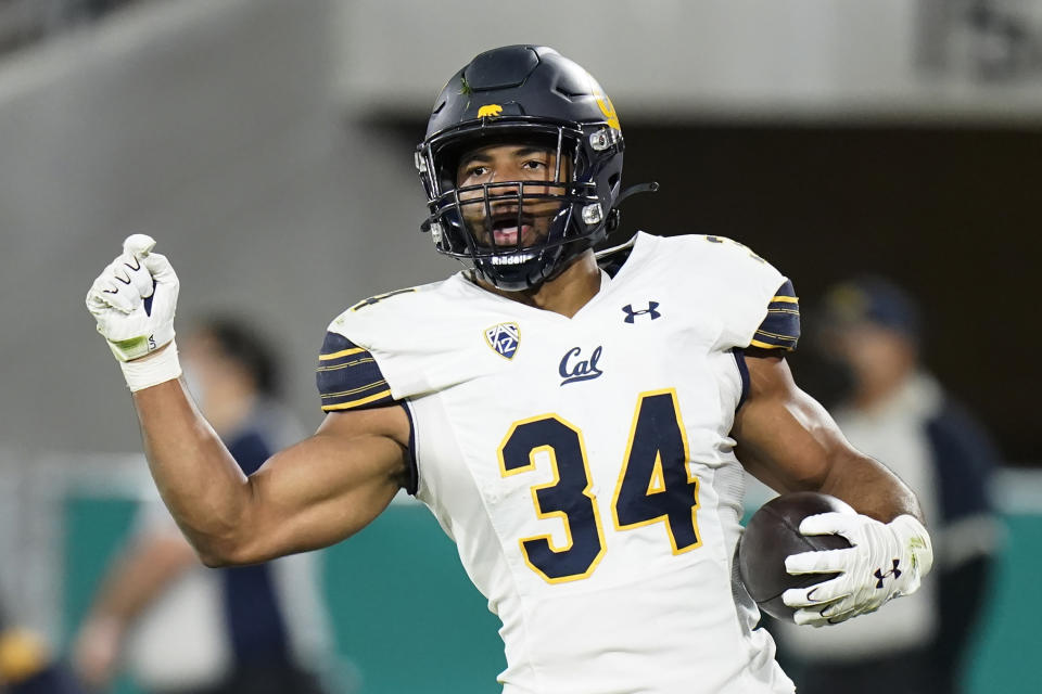 FILE - California running back Christopher Brooks scores a touchdown during the first half of an NCAA college football game against UCLA on Nov. 27, 2021, in Pasadena, Calif. The transfer enters the season as Tyler Allgeier’s successor as BYU's lead back. He made his mark in three seasons with the Bears, leading California in rushing in 2019 and 2021 seasons. (AP Photo/Jae C. Hong, File)