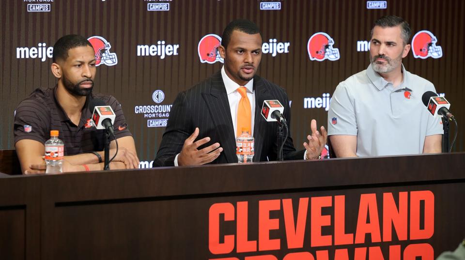 Cleveland Browns quarterback Deshaun Watson, center, takes questions from local media during his introductory press conference Friday at the Cleveland Browns Training Facility.