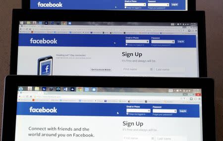 Computer screens display the Facebook sign-in screen in this photo illustration taken in Golden, Colorado, United States July 28, 2015. REUTERS/Rick Wilking