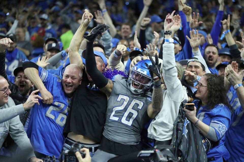 Detroit Lions running back Jahmyr Gibbs celebrates his touchdown with Lions fans against the Las Vegas Raiders during the second half at Ford Field, Monday, Oct. 30, 2023.