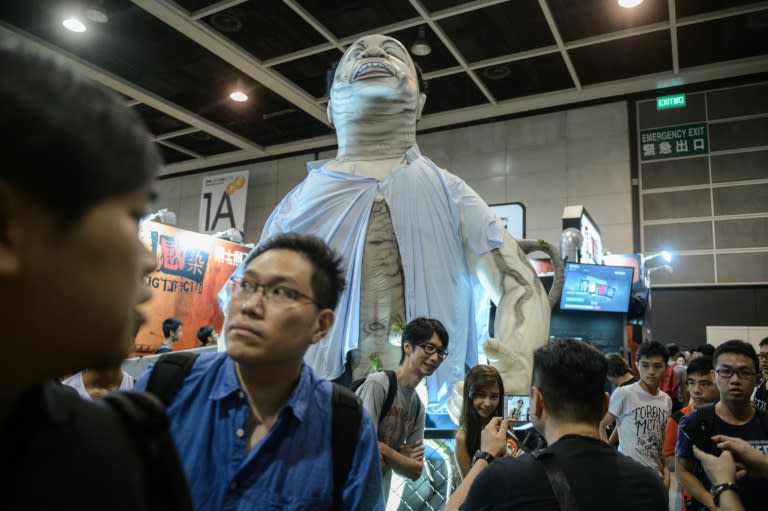 A statue of a local politician is displayed at the stall of a virtual reality game called "Hong Kong Infected" at the Ani-Com show in Hong Kong on July 29, 2016