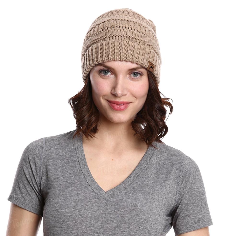 I've had this <a href="https://www.amazon.com/dp/B01MAZ6D4F/ref=twister_B01M9DKJJP?_encoding=UTF8&amp;th=1" target="_blank">beanie</a> through my transitioning phase up until my full natural phase and it never disappoints. It actually stays on my head, fits over my curls, and for under $10 it's a true steal.