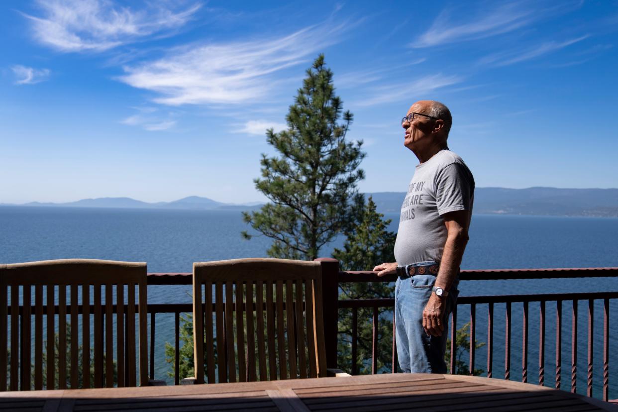 Jack Hanna starts his day in the early afternoon by taking in the views of Flathead Lake from the deck of his home in Bigfork, Mont. on May 2, 2023. Jack was diagnosed with Alzheimer’s in October 2019. One symptom is sundown syndrome, which causes increased confusion in the evening resulting in staying up late. Jack’s wife, Suzi, says he frequently stays up until 3 or 4 a.m. and sleeps past noon.