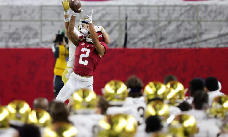 Patrick Surtain goes up for a ball against a Notre Dame receiver.