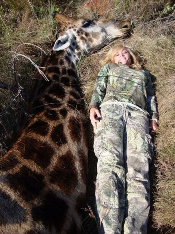 Outcry after Ricky Gervais tweets horrific picture of female hunter posing with dead giraffe