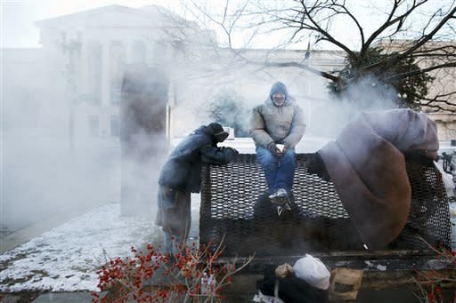 If you can't help someone find shelter, or if the temperatures are still cold but not blistering (in many cities, including New York City and Washington, D.C., shelters are only required by law to shelter everyone who seeks help if the temperature is below 32 degrees, Stoops said), then helping them with small comforts like blankets, warm clothing or hot food could go a long way. <br> <br> But keep this in mind: Even if you have the best of intentions, Stoops recommends that you use tact when approaching someone who you think is homeless.  <br> <br> "There's a lot of shame involved in being homeless," he said, so avoid making assumptions or asking personal questions.  <br> <br> Instead, Stoops says that you should consider following these steps: "If I have a blanket or a pair of socks or something, what I'll generally do is I'll introduce myself before asking for their name. Then rather than ask if they're homeless, I'll ask them: 'Where did you sleep last night?' I'll then ask the person if he or someone he knows could use the blanket I have."  <br> <br> Even if you don't have an extra blanket on hand or warm clothing to spare, there's still something you can do. An act of kindness can lift spirits, Stoops says, and can be just as useful on a cold, dark night. <br> <br> "Our homeless friends have told us that oftentimes, simple conversation or just being treated nicely, with dignity and respect, is as important as getting something tangible," he said. <br> <br> <em>(In the photo above, four homeless men are pictured warming themselves on a steam grate by the Federal Trade Commission, blocks from the Capitol, during frigid temperatures in Washington, Saturday, Jan. 4.)</em> 