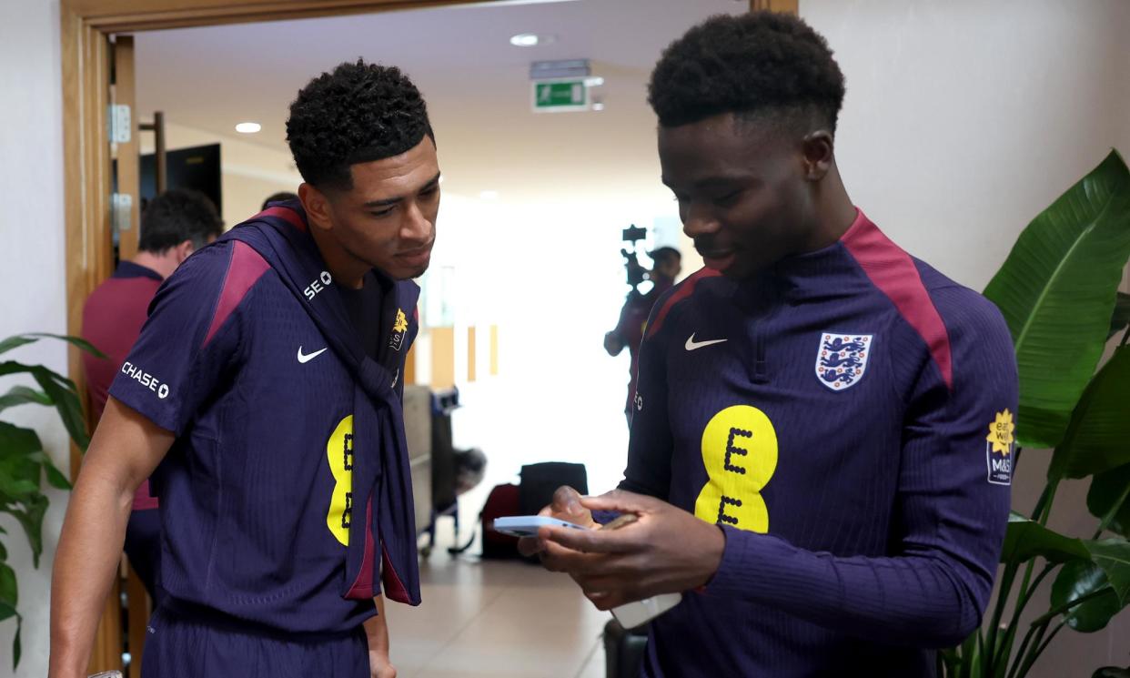 <span>Bukayo Saka (right) with Jude Bellingham at St George's Park this week before his withdrawal to return to Arsenal.</span><span>Photograph: Eddie Keogh/The FA/Getty Images</span>