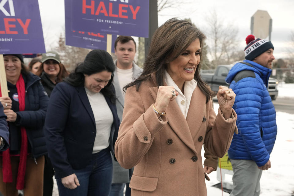 Republican presidential candidate former U.N. Ambassador Nikki Haley gestures while walking with supporters, Tuesday, Jan. 23, 2024, near a polling site at Winnacunnet High School in Hampton, N.H. (AP Photo/Steven Senne)