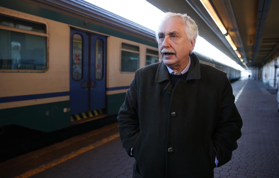 Italian government's extraordinary commissioner for the Lyon-Turin railway Paolo Foietta, speaks with the Associated Press during an interview at the Porta Nuova train station in Turin, Italy, Monday, Feb. 11, 2019. Foietta says there are important deadlines that if missed could take the project irreparably off course, and prompt the EU and France to ask for money back and damages. (AP Photo/Antonio Calanni)